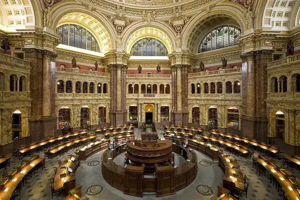 The domed main reading room of the Library of Congress, with concentric rings of desks around a central circulation desk